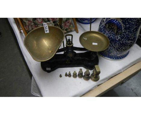 2 sets of brass scales and weights.