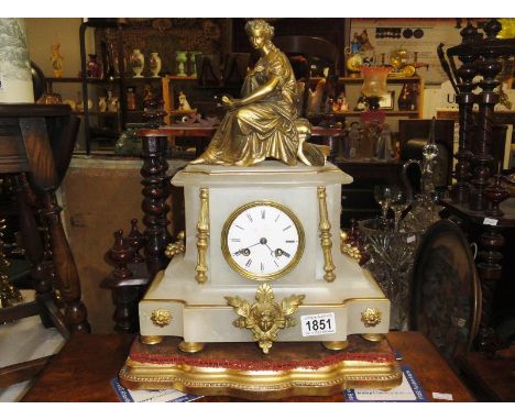 An onyx and gilt mantel clock surmounted Greek style lady.