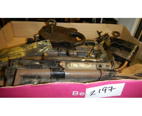 A quantity of old padlocks and spring scales.