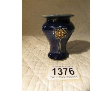 A miniature Royal Doulton art nouveau vase.