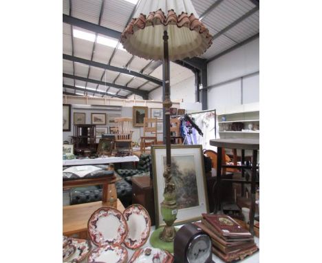 An onyx and gilt standard lamp with shade.