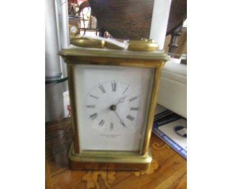 A brass carriage clock.