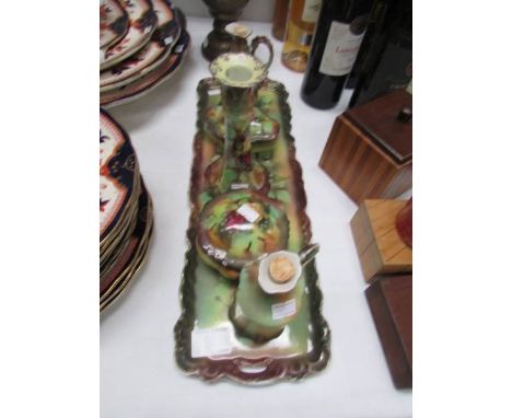 An Edwardian ceramic dressing table set.