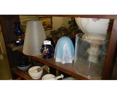 A quantity of old lamp glass shades.