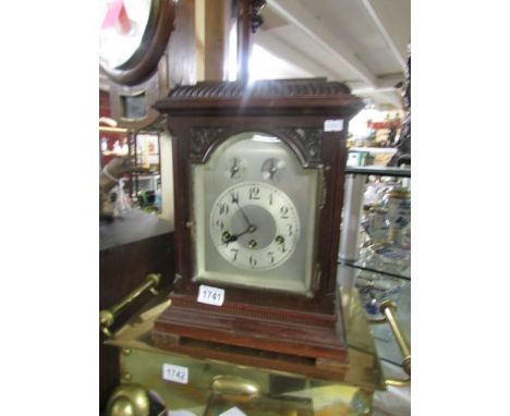 A mahogany mantel clock.