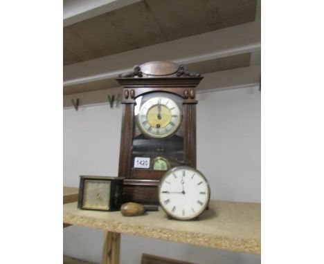 An old mantle clock and 2 smaller clocks.