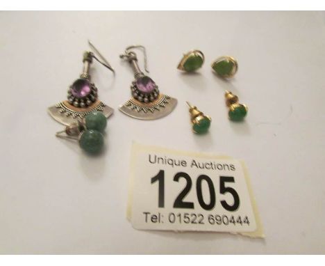 A pair of pendant earring in art deco style and 3 pairs of stud earring in various settings.