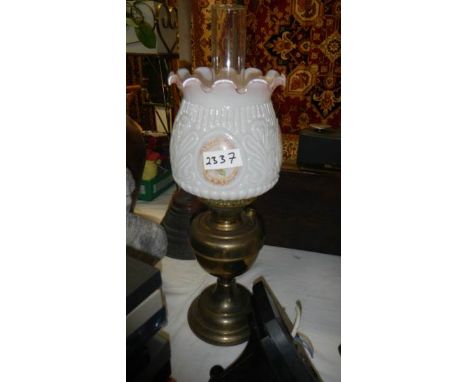 A brass oil lamp.