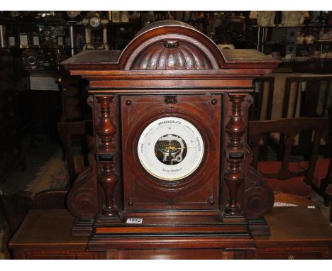 A Veranderlich aneroid barometer in ornate case.