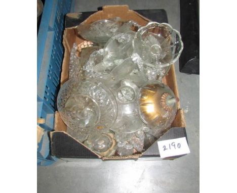 A box of assorted chandelier parts.