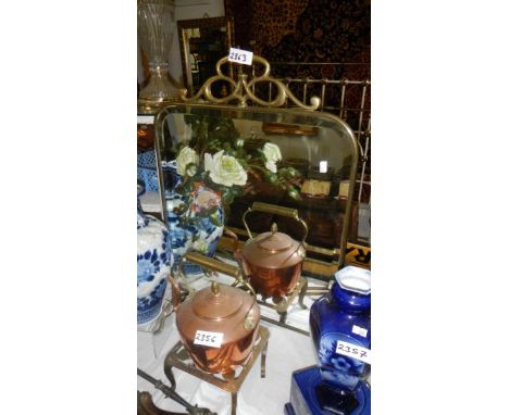 A Victorian brass fire screen with painted glass panels.