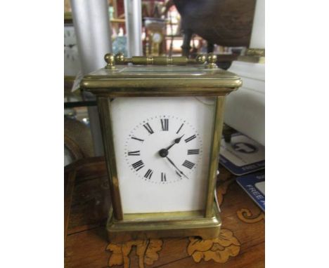A brass carriage clock.