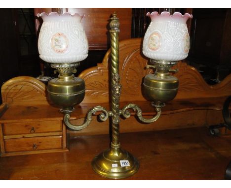 A double brass oil lamp.