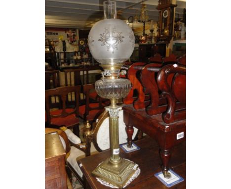 A brass Corinthian column oil lamp with Hinks burner and cut glass font.