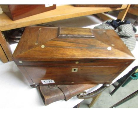 A Victorian mahogany tea caddy.