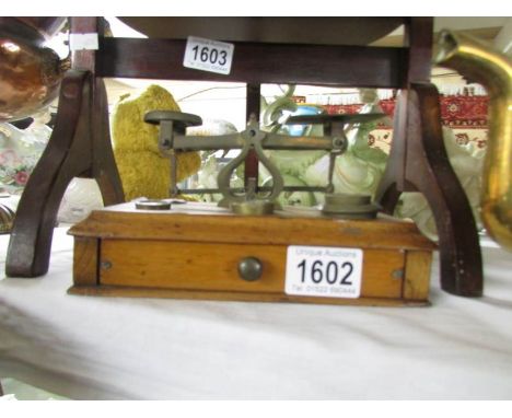 A set of brass postal scales.