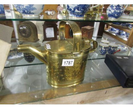 A brass water can by R Perry & Sons, Wolverhampton.