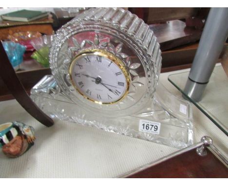 A glass mantel clock.