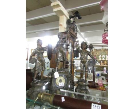 A 3 piece clock garniture surmounted figures,.