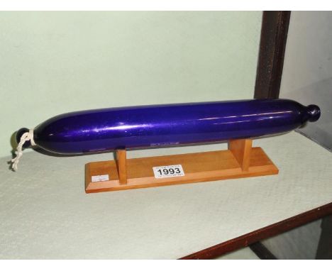 A Bristol blue glass rolling pin.