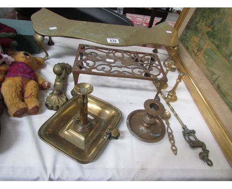 A mixed lot of brass ware including trivets, candlesticks. toasting fork etc.,