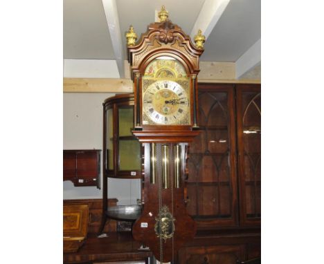 A Wall clock, triple weight, 8 day mechanical movement, bass, arch dial, moon roller, 12" dial, 3 multi chimes and silent, bu