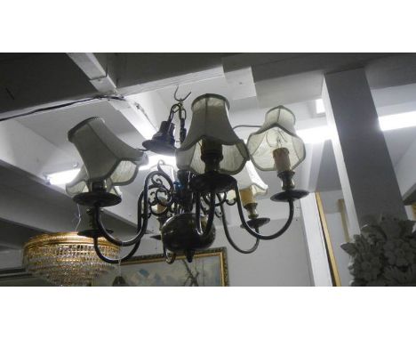 A 6 lamp brass ceiling lamp.