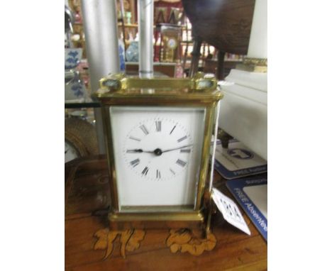A brass carriage clock.