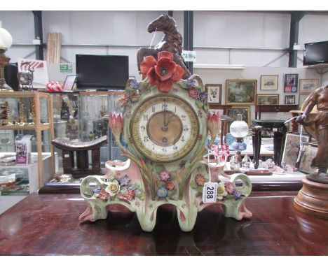 A decorative ceramic mantel clock.