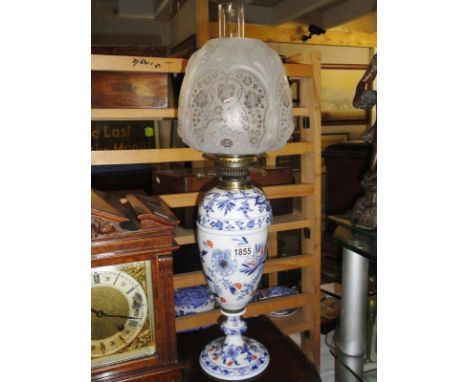 A Victorian ceramic oil lamp base with not matching font.