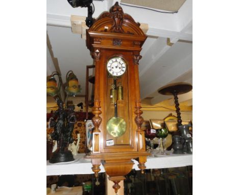 A Gustav Becker regulator wall clock, signed on movement, 4" dial geared down, oak carved case.
