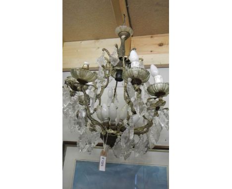 An old 8 lamp chandelier for restoration.
