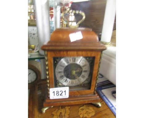 A small bracket style mantel clock, 8 day, fixed key, walnut case.
