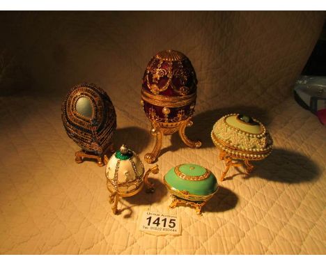 5 decorative egg shaped trinket boxes.