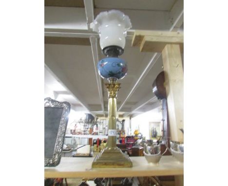 A brass Corinthian column oil lamp with vaseline glass shade.