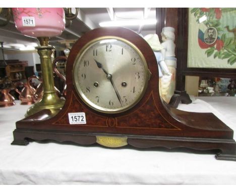 A presentation mantel clock dated 1928.