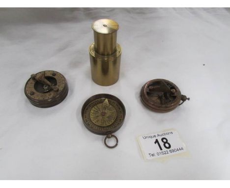 A Dolland of London brass compass, one other brass compass and one other item.