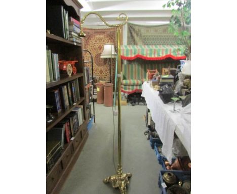 A heavy brass standard lamp.