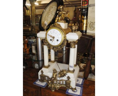 A marble and gilt mantel clock.