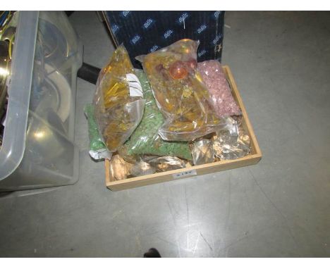 A box of chandelier droppers and buttons.