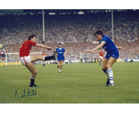 Autographed NORMAN WHITESIDE 12 x 8 Photo : Col, depicting Man United's NORMAN WHITESIDE superbly curling the ball around Eve