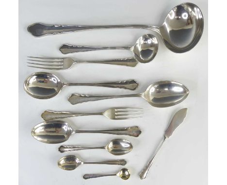 An extensive George V silver 12-place setting cutlery suite in the Dubarry pattern, comprising 12 soup spoons, 12 table forks