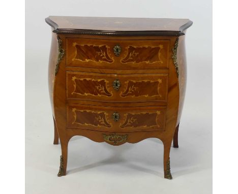 A Louis XV style walnut and marquetry small bombe commode, having three frieze drawers and with gilt metal mounts, w.81cm, d.