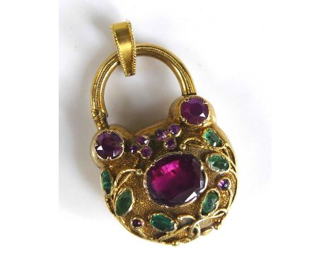 A George III yellow metal padlock style memorial pendant, set with a centre 8.2 x 7mm oval ruby within a foliate surround set