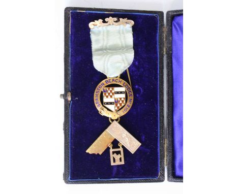 An Edwardian 9ct gold and enamel Masonic jewel for the Bramston Beach Lodge No.2101, with silk ribbon and gilt metal pin, mak