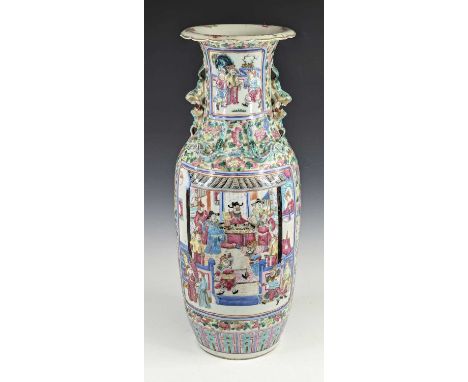 A Chinese Canton porcelain vase, 19th century, enamel decorated with interior scenes, relief decorated with kylin and shishi,