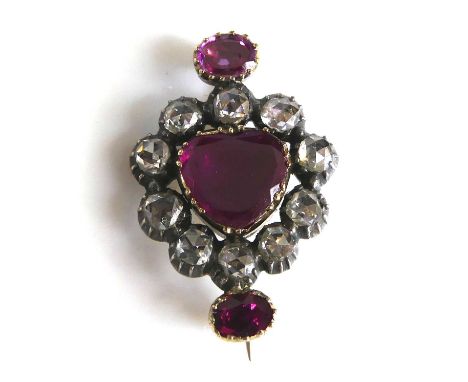 A George III ruby and diamond cluster brooch, featuring a centre 8.2 x 8.6mm triangular cut ruby within a border of ten rose 