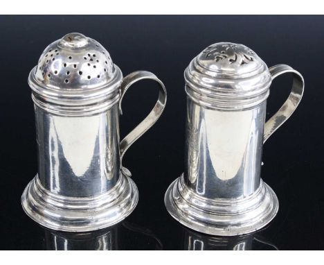 A George II silver pepperette, of cylindrical form with pierced and domed removable cover, raised on a stepped flaring foot, 