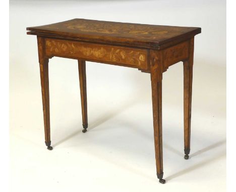 An early 19th century Dutch walnut and floral marquetry inlaid card table, the fold-over top having swivel action and baize l