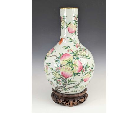A Chinese porcelain vase, of tianqiuping form, having a gilt rim, enamel decorated in the Nine Peaches pattern, h.43cm, upon 